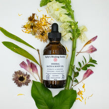 Load image into Gallery viewer, &quot;Herbal Bath and Body Oil&quot; bottle with leaves and flowers around it.
